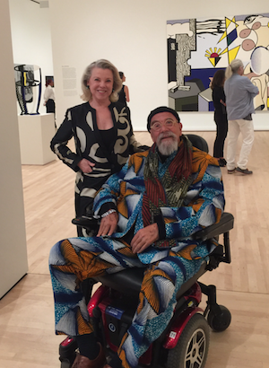 Jeanne Lawrence with artist Chuck Close, whose works of art fill three galleries.